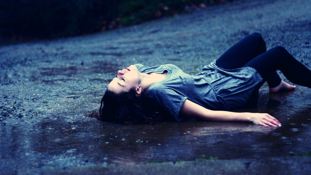 young-girl-lying-in-the-rain-1366x768